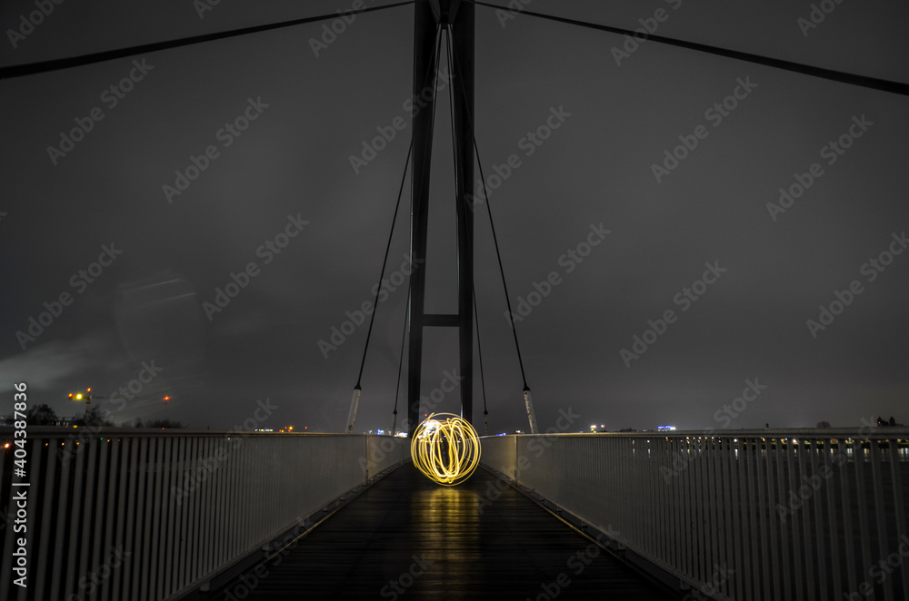 Illuminated Suspension Bridge At Night - obrazy, fototapety, plakaty 