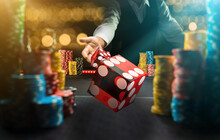 Man Gambling At The Craps Table At The Casino