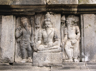 Wall Mural - Bas-relief of meditating old man, Prambanan, Yogyakarta, Java, Indonesia