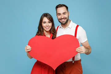 smiling beautiful young couple two friends man woman wearing white red clothes standing hold big hea