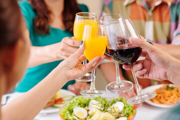 Poster - Close-up image of friends clinking glasses over dinner table at party