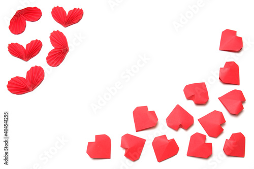 Several handmade red accordion folded and 3D paper hearts on white background isolated. Love, Valentine's, mother's, women's day, relations, wedding, romantic poster template copy space 