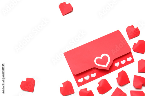 Envelope from red paper with hearts and several handmade 3D red paper hearts on white background isolated. Love, Valentine's, mother's, women's day, relations, wedding, romantic template copy space 
