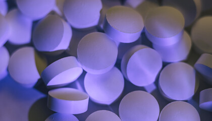 Fototapete - Pills or drugs in a package under neon light. Beautiful background pattern for design.