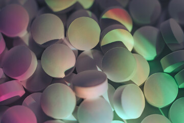 Fototapete - Pills or drugs in a package under neon light. Beautiful background pattern for design.