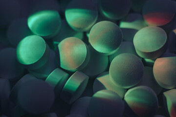 Fototapete - Pills or drugs in a package under neon light. Beautiful background pattern for design.