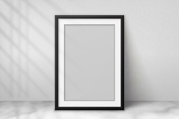 Wall Mural - mockup black frame photo on wall. mock up artwork picture framed. vertical boarder with shadow. empt
