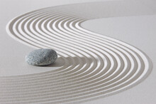 Japanese Zen Garden With Stone In Textured Sand