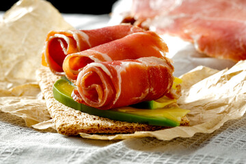 Poster - Fresh Serrano ham on the table in the light of the morning sun