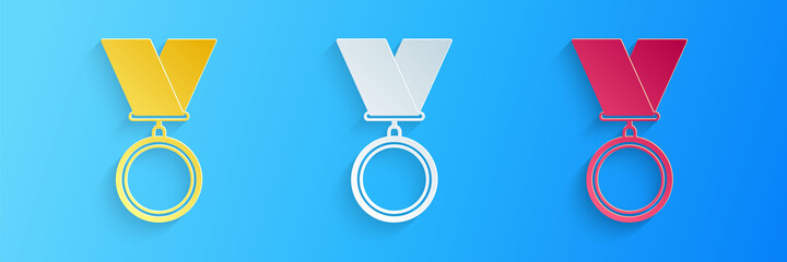 Paper cut Medal icon isolated on blue background. Winner symbol. Paper art style. Vector.