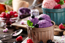 Blackberry Icecream Balls In Clay Bowls On Wooden Kitchen Table With Flowers And Berries Aside