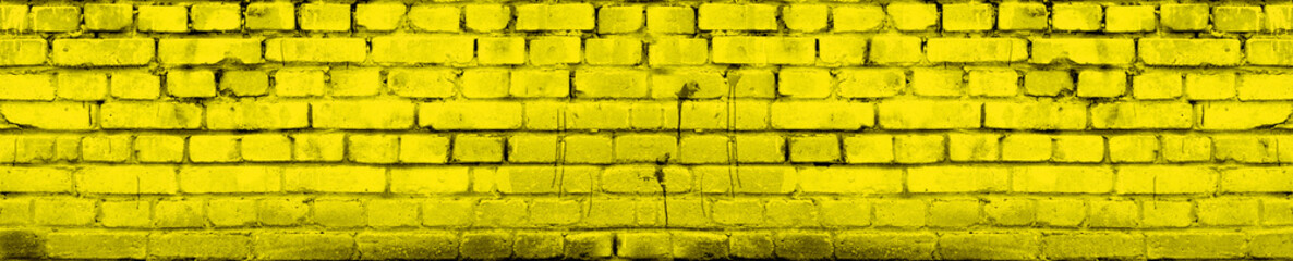 Wall Mural - Yellow Brick Wall Background Panoramic Banner. Vivid Aged Brickwork Texture Toned.