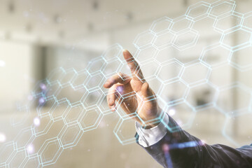Wall Mural - Male hand clicks on abstract virtual technology sketch with hexagon grid on blurred office background, future technology and AI concept. Double exposure