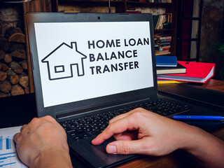 Sticker - Home loan balance transfer info on laptop screen.