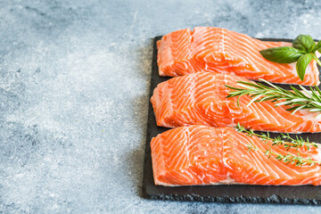 Wall Mural - Salmon. Fresh raw salmon fish fillet with cooking ingredients, herbs and lemon. healthy food, diet or cooking concept