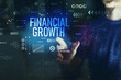 © Tierney - Financial growth with young man touching screen at night