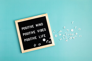 Positive mind, positive vibes, positive life motivational quote on the letter board. Inspiration text