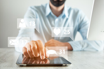 man holding tablet with social network icons