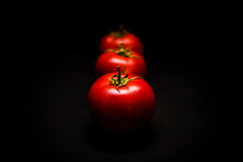 Close-up Of Tomatoes Against Black Background