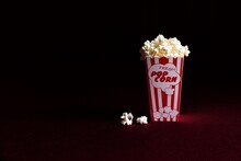 Close-up Of Popcorns Against Black Background