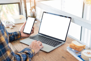 computer screen,cell phone blank mockup.hand woman work using laptop texting mobile.with white backg