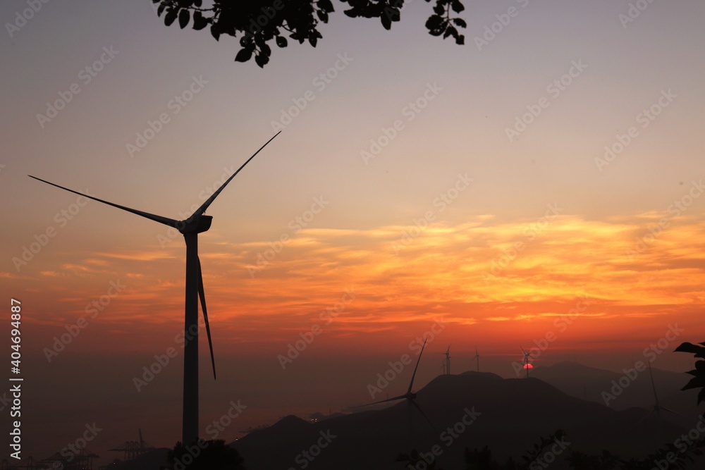 Silhouette Wind Turbines On Mountains Against Romantic Sky At Sunset - obrazy, fototapety, plakaty 
