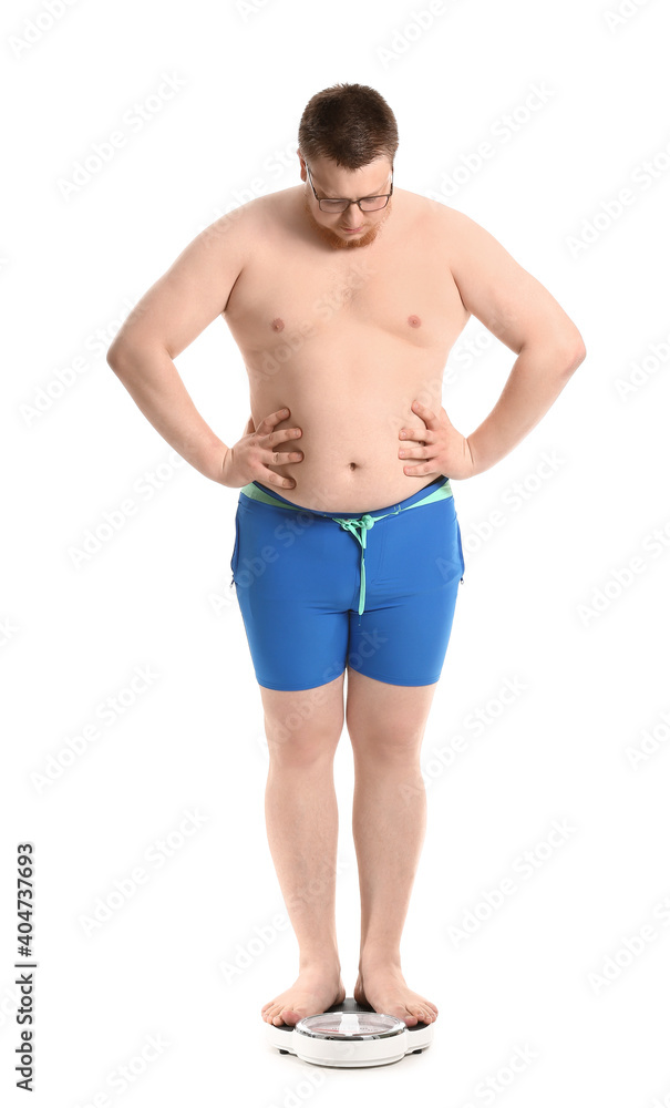 Overweight man with scales on white background. Weight loss concept