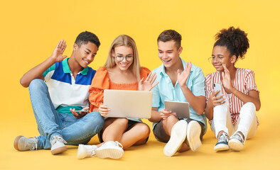 Sticker - Teenagers with different devices video chatting on color background