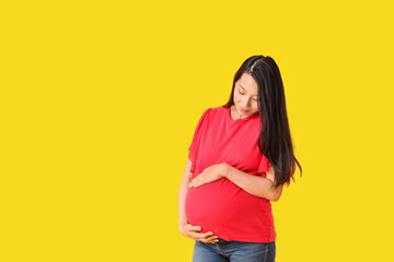 Sticker - Pregnant Asian woman on color background