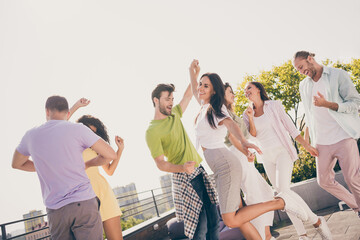 Poster - Low angle view photo of cheerful young friends happy smile enjoy rhythm music dance have fun summer party