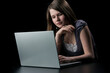 © antoniotruzzi - Young girl with long brown hair to the laptop
