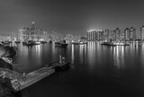 Fototapeta  - Night scenery of harbor and skyline of Hong Kong city