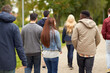 © Syda Productions - people, friendship, communication and international concept - group of happy friends walking along autumn park
