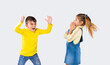 © Viorel - Preschool boy scares his girlfriend on a white background. The concept of emotions and the time spent by children.