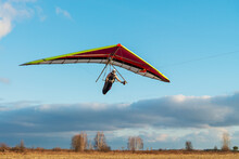 Girl Student Is Mastering Hang Gliding Sport.