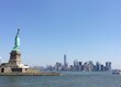 Statue Of Liberty With Buildings In Background Against Clear Sky