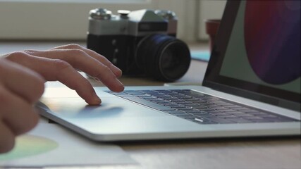 Wall Mural - close up. designer works on a laptop, choosing the right color.