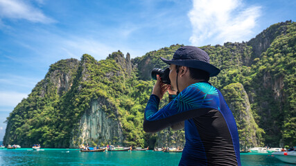 Wall Mural - Photographer With Island Sea View 