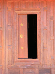 Wall Mural - Open window. Thai style wooden windows on brown wood wall background