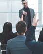 © yurolaitsalbert - employees ask questions to the speaker during the business seminar.