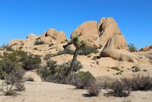 Rock Formations In Desert Against Clear Blue Sky