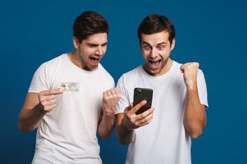 Sticker - Delighted two guys posing with credit card and mobile phone