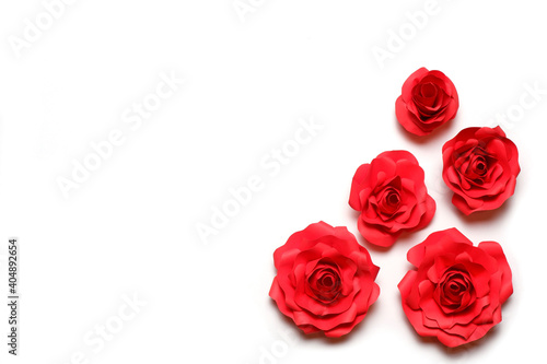 Few handmade red paper roses on white background. Love, Valentine's, mother's, women's day, relations, romantic, wedding template 