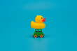 Toy car carrying yellow duck. Toy donation and delivery concept