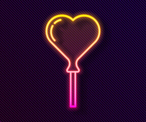 Poster - Glowing neon line Balloons in form of heart with ribbon icon isolated on black background. Vector.