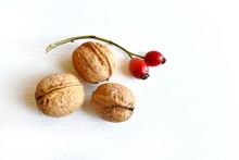 Walnuts With Red Rose Hips, Composition, Still Life, Autumn Fruits On A White Background