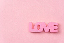 Pink Love Letters On A Pink Background With Copy Space.