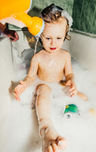 Beautiful Child Toddler Son Washes In The Bathroom Plays Has Fun With Soap Bubbles,foam