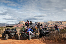 A Group Of Friends On ATV All Terrain Vehicles In A Desert