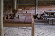 Interior of a wooden hut. Wooden logs and table. Slavic medieval house.